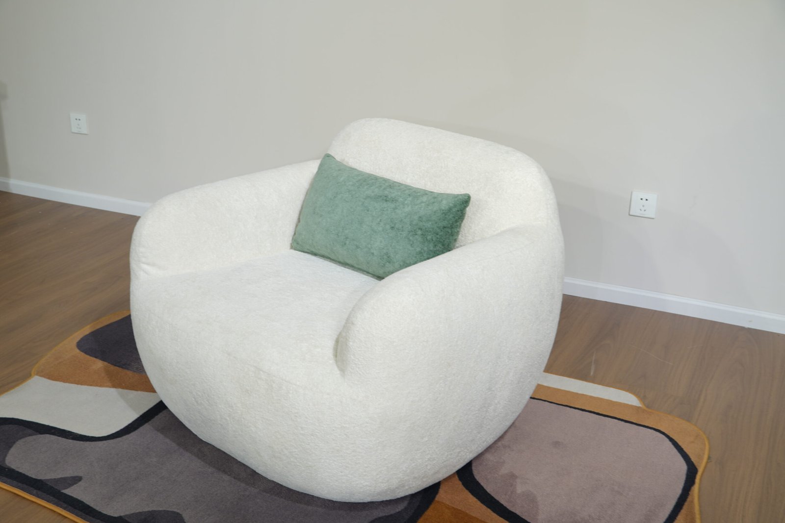 Front view of Nestory Sofa rounded white armchair
