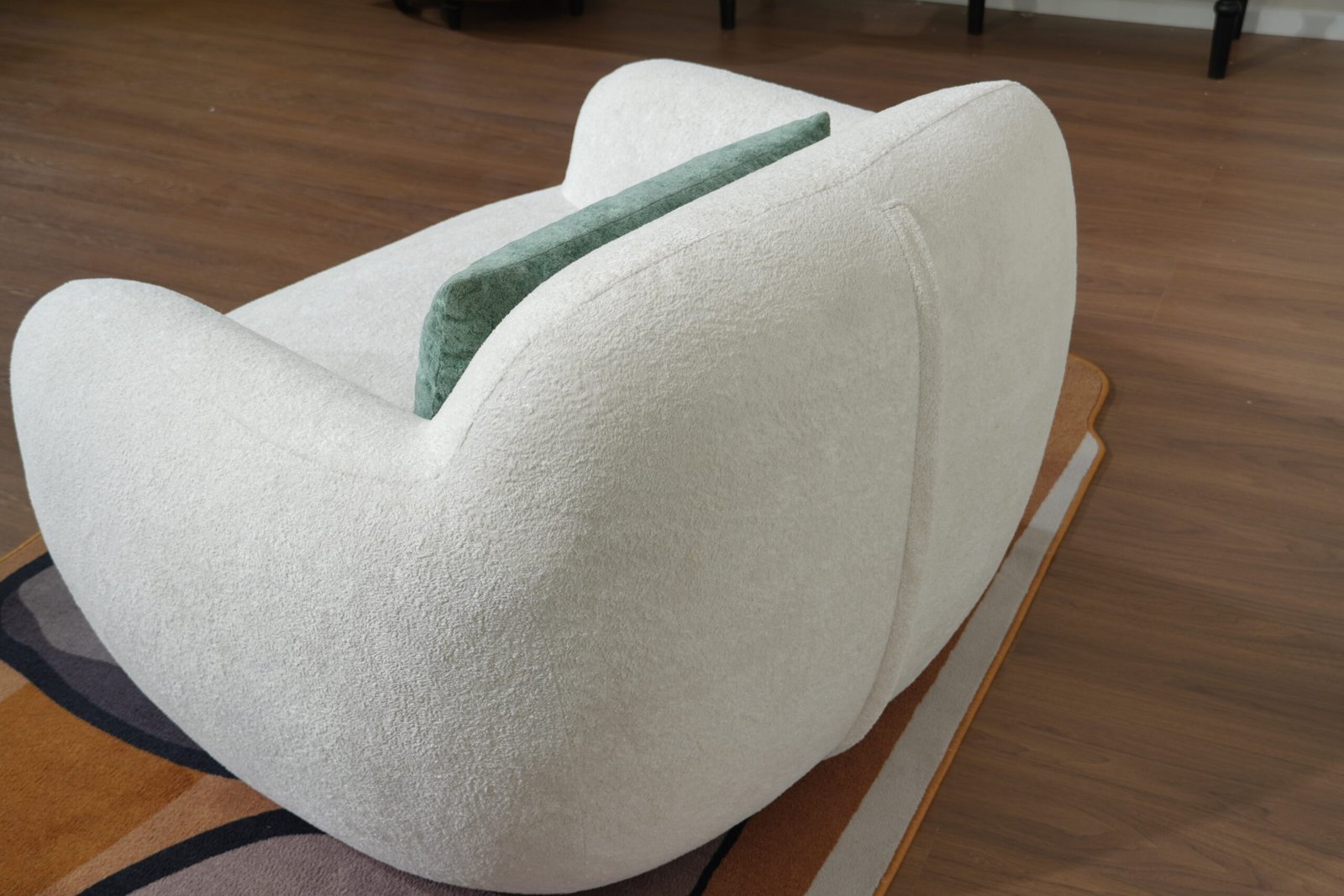 Rear view of Nestory Sofa sculptural curved chair